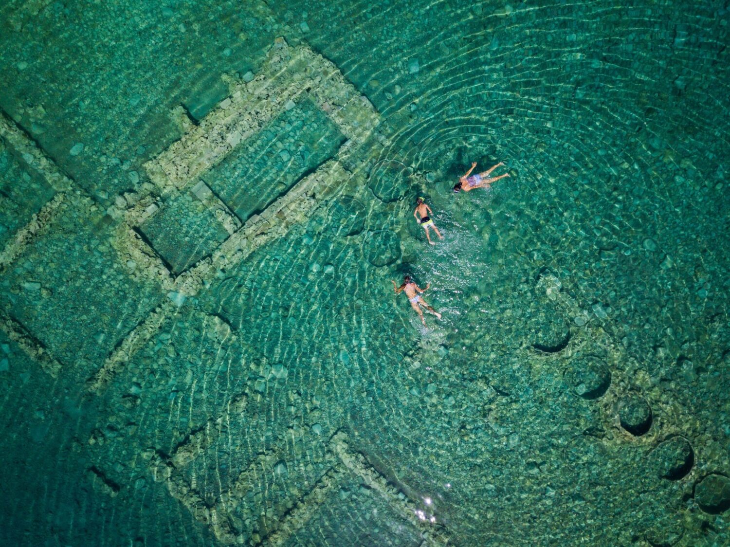 Aerial,Drone,Bird's,Eye,View,Photo,Of,Tourists,Snorkeling,Above